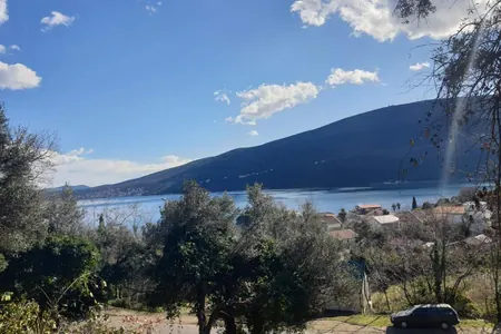 A plot of land with a project in Đenovići is for sale.
