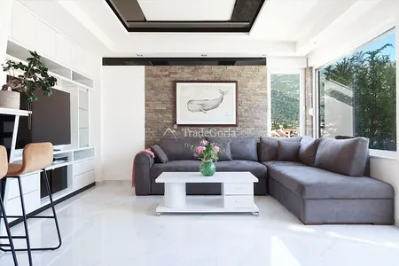 Apartment with 3 bedrooms in the center of Budva with 85m2 roof, storage room, and garage space