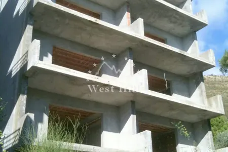 Plot with unfinished 9-apartments building with sea view