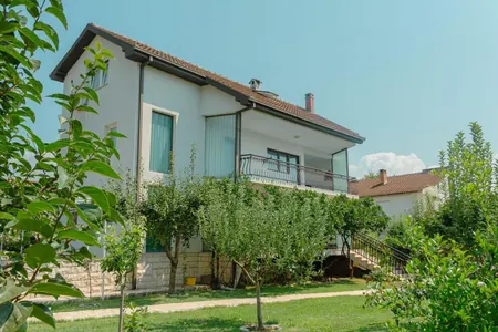 The house is 400 m2 with a large plot.