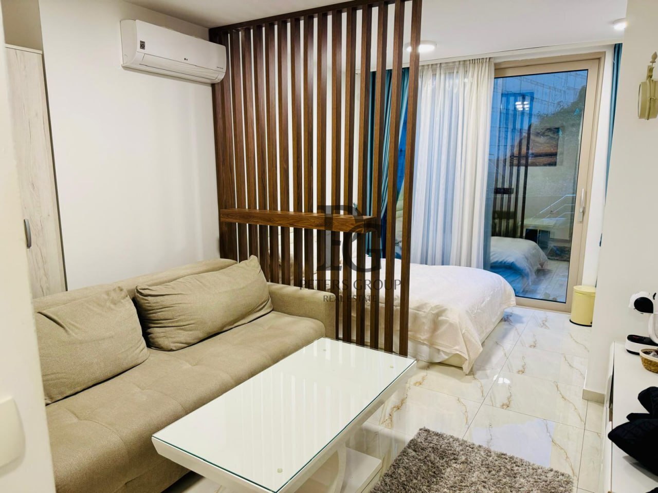 Studio apartment with a large terrace in a complex with a swimming pool in Rafailovici for sale