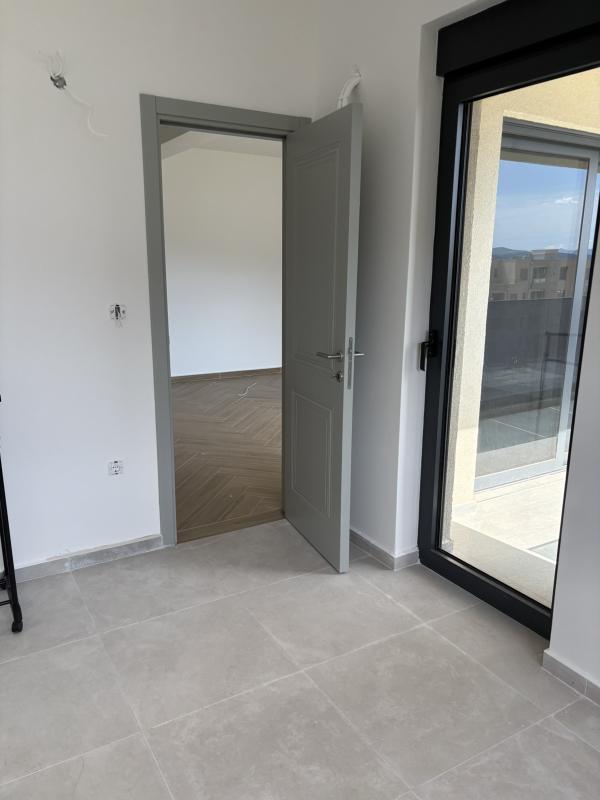 A 2-bedroom apartment for sale in a complex under construction in Baošići.