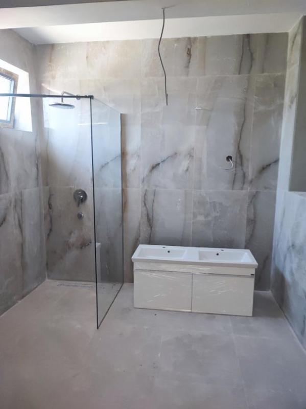 A 2-bedroom apartment for sale in a complex under construction in Baošići.