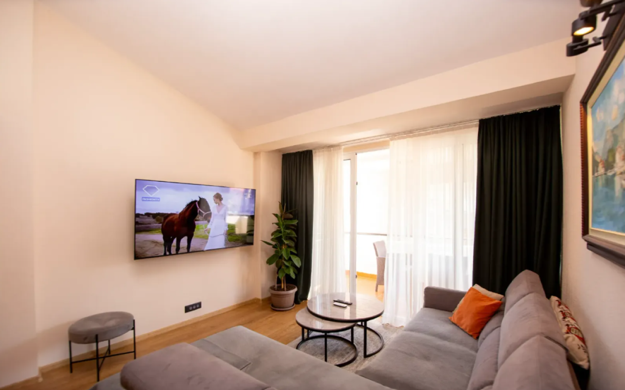 Apartment for sale with a large roof terrace in Budva