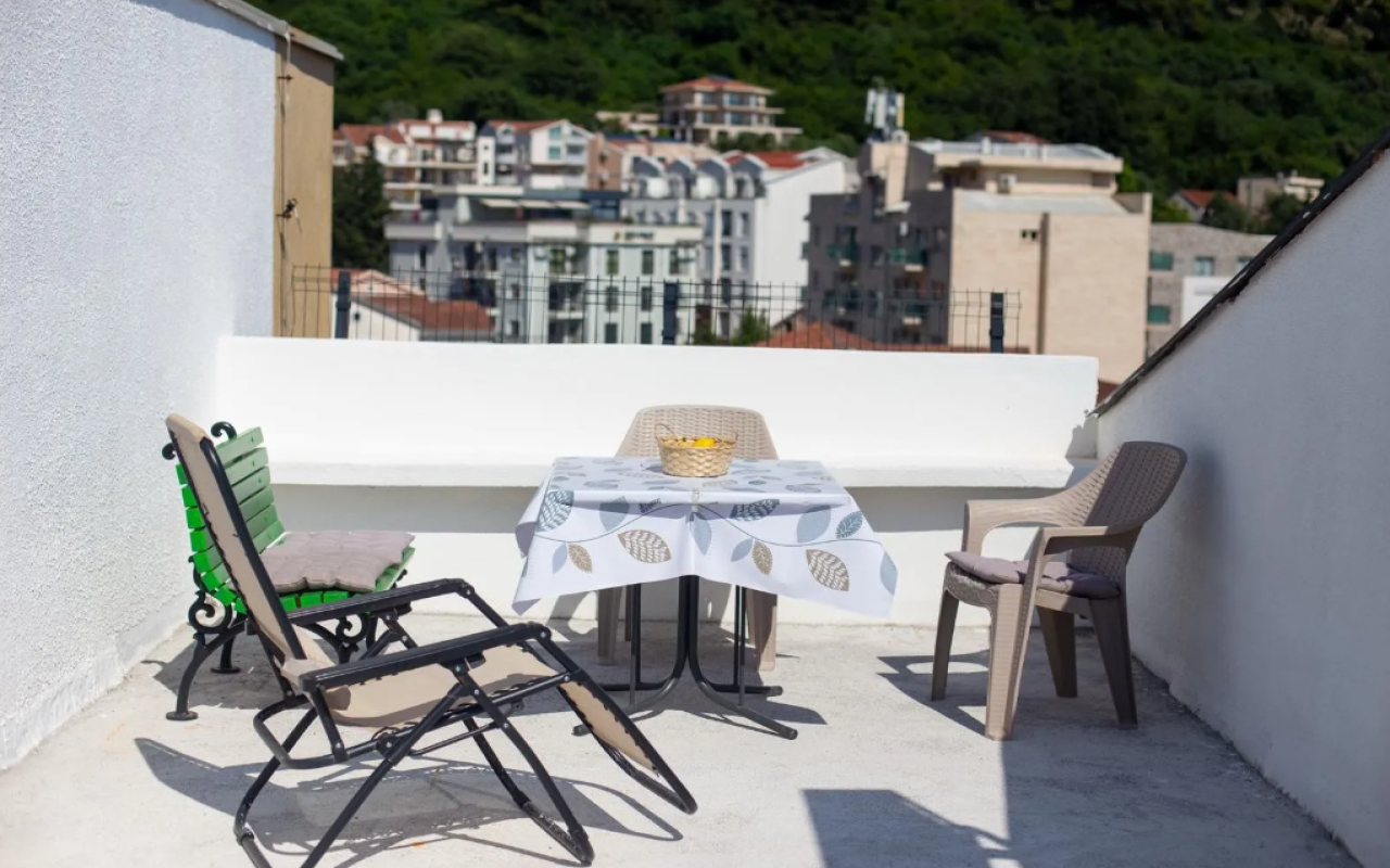 Apartment for sale with a large roof terrace in Budva
