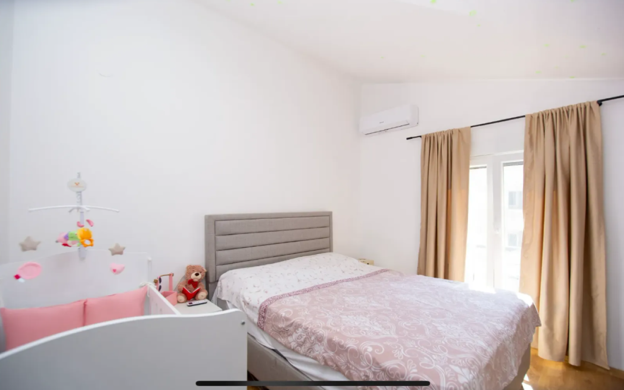 Apartment for sale with a large roof terrace in Budva