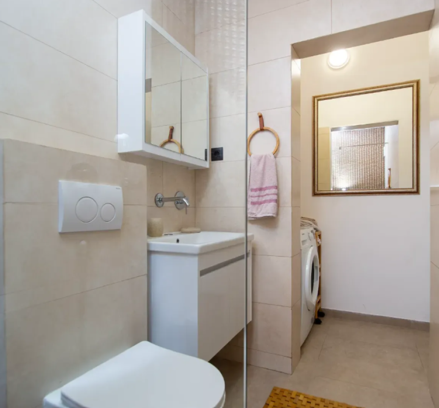 Apartment for sale with a large roof terrace in Budva