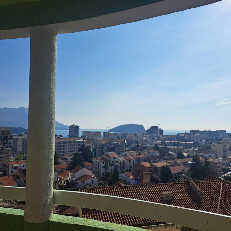 Apartment for sale with garage and sea view in Budva.