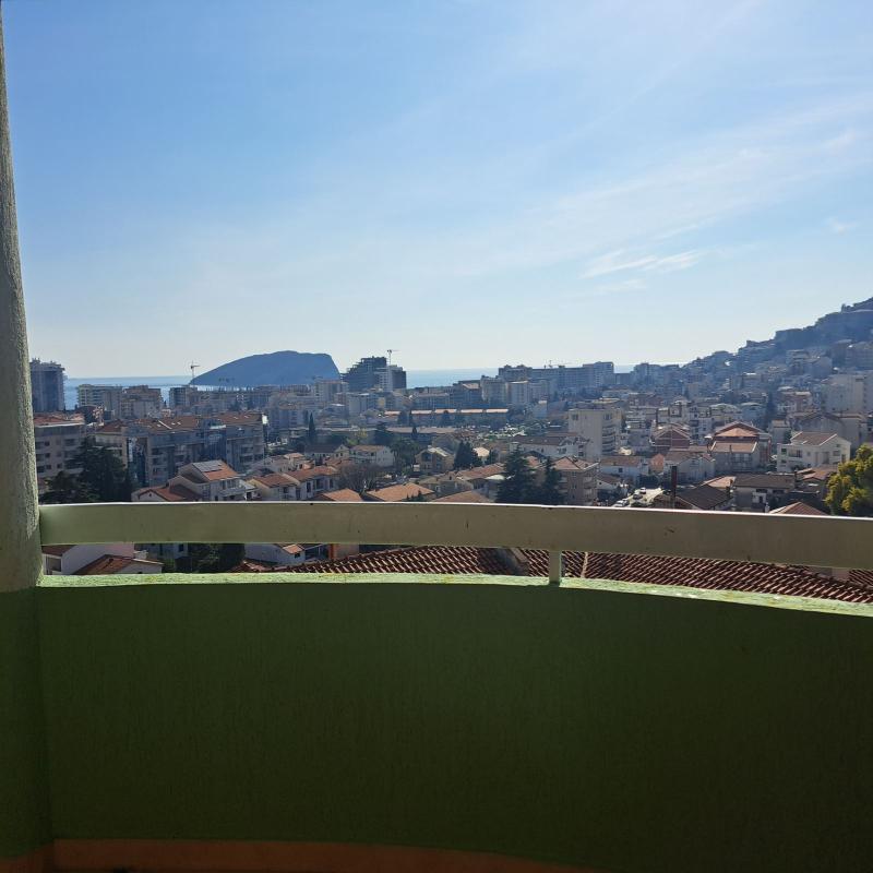 Apartment for sale with garage and sea view in Budva.
