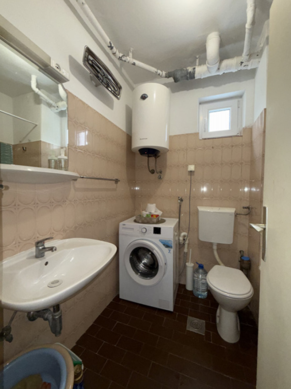 Apartment with 2 bedrooms and a courtyard for sale in Budva.