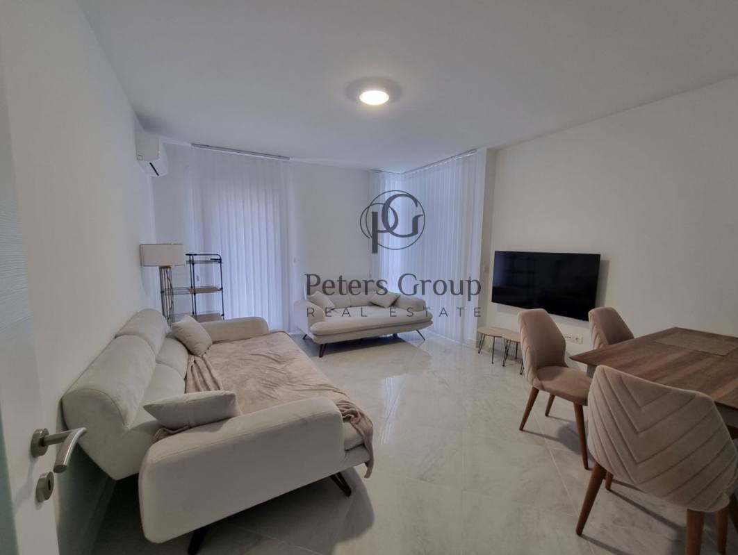 For sale large, bright three-bedroom apartment in a premium building in Budva