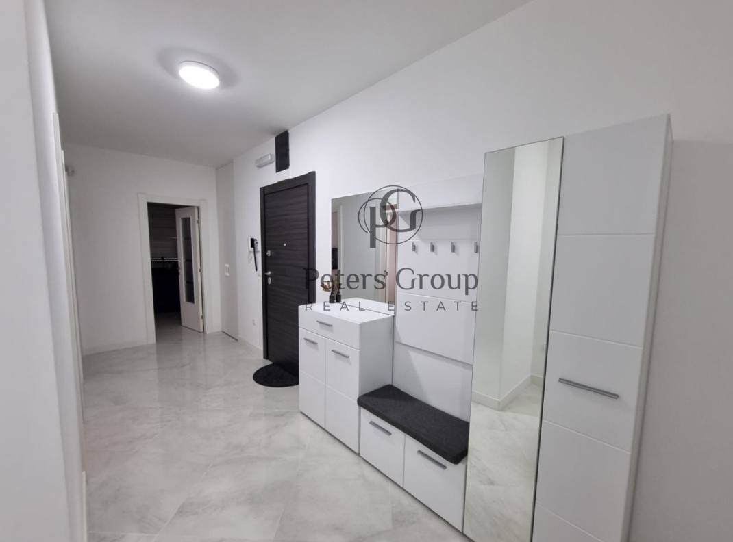 For sale large, bright three-bedroom apartment in a premium building in Budva