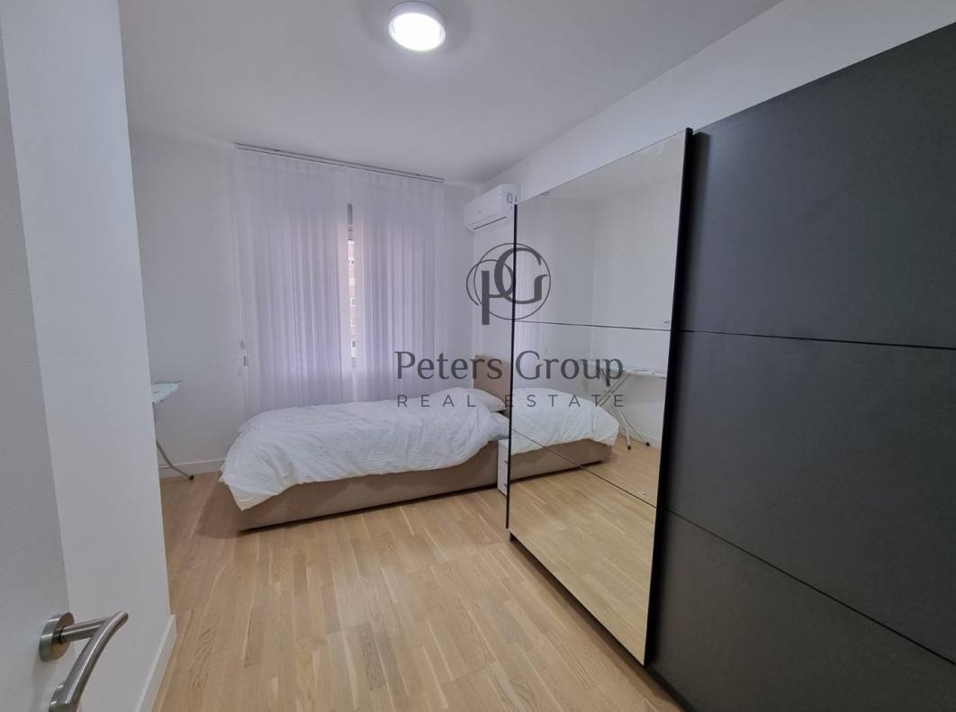 For sale large, bright three-bedroom apartment in a premium building in Budva