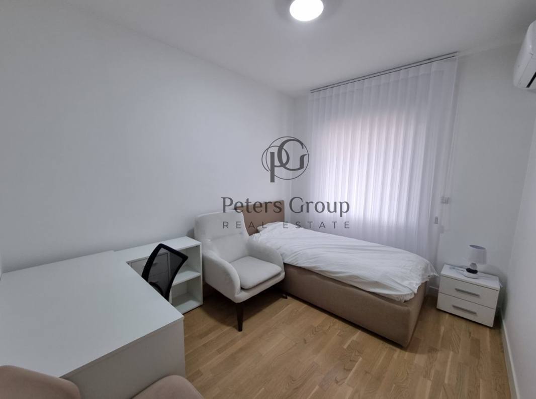 For sale large, bright three-bedroom apartment in a premium building in Budva