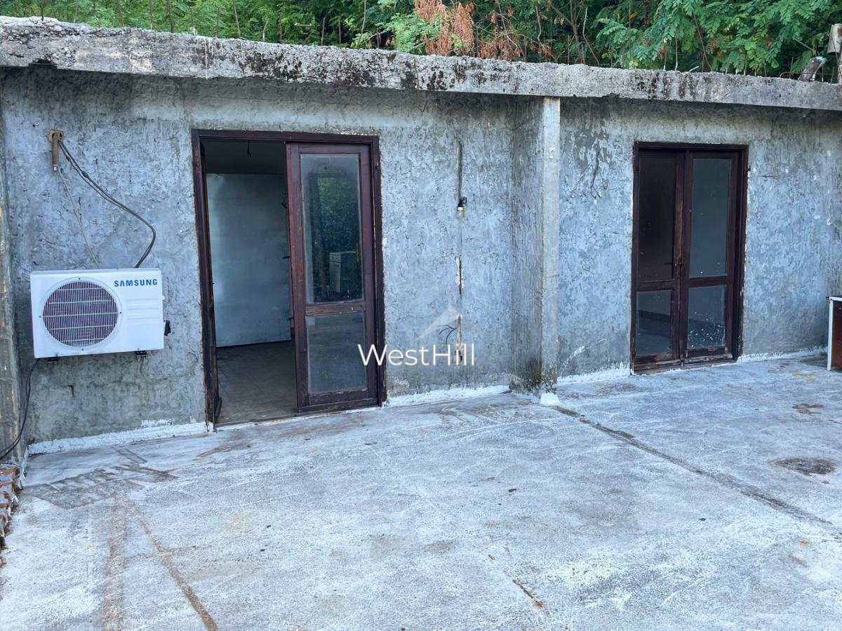 Unique plot with waterfall and house for renovation